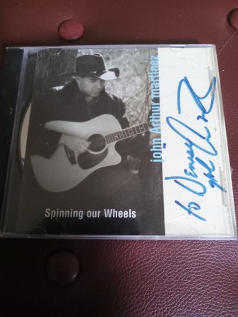 John Arthur Martinez-Spinning Our Wheels-CD-FLAC-1998-FLACME